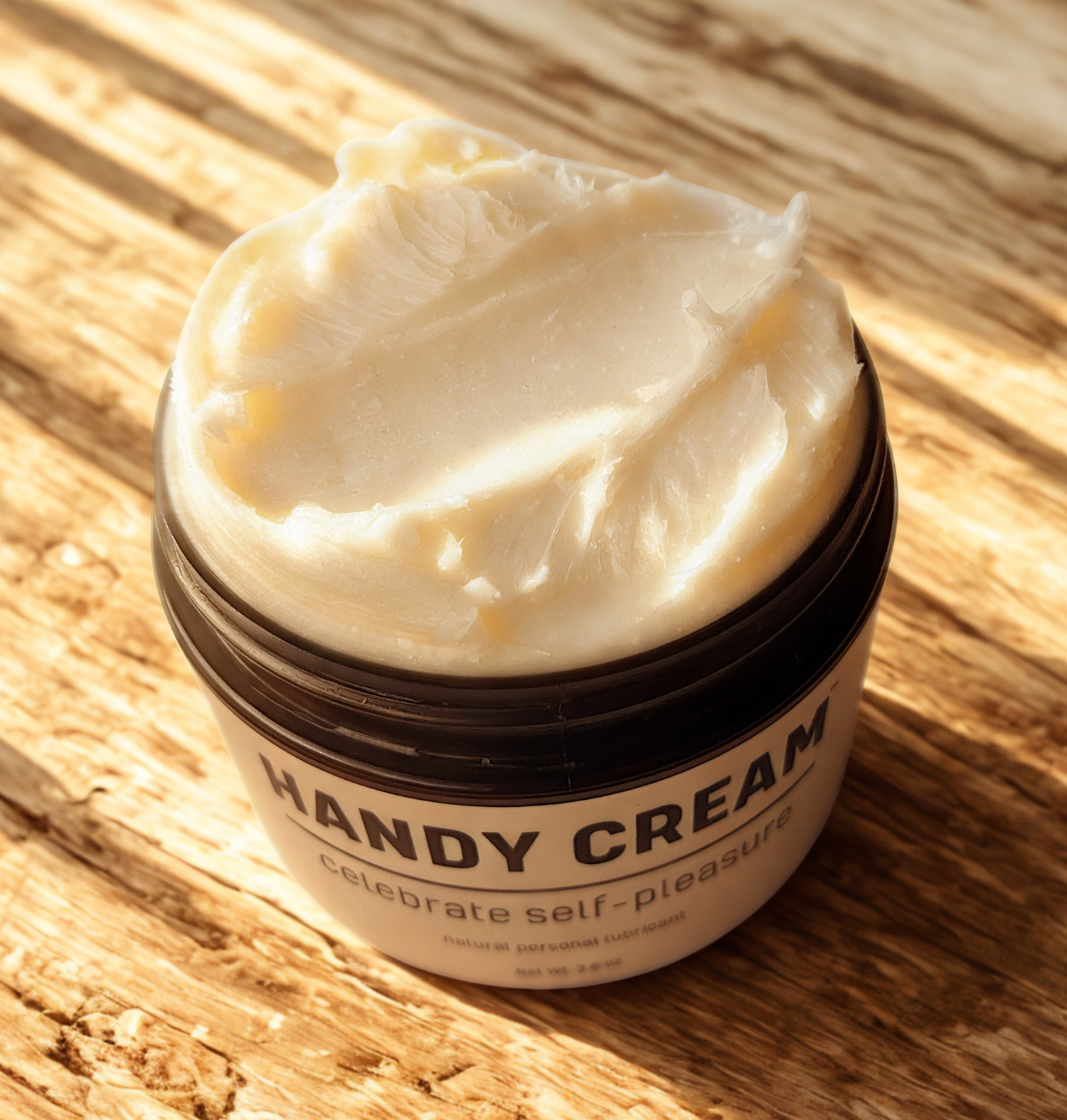 Jar of Handy Cream on a wooden surface